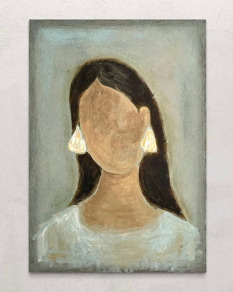 Woman with shell earrings